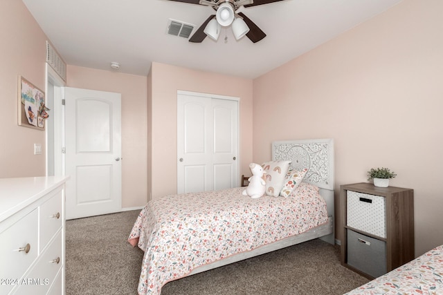 carpeted bedroom with ceiling fan and a closet