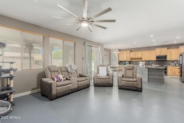 14604 W Banff Ln, Surprise, AZ 85379 - living room featuring a ceiling fan, finished concrete floors, recessed lighting, and baseboards