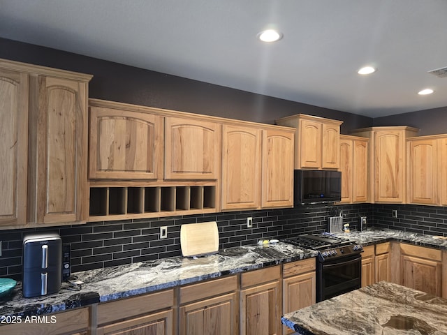 14604 W Banff Ln, Surprise, AZ 85379 - kitchen with black appliances, stone counters, decorative backsplash, light brown cabinets, and recessed lighting