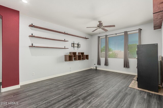 14604 W Banff Ln, Surprise, AZ 85379 - unfurnished living room featuring ceiling fan, dark wood-type flooring, baseboards, and recessed lighting