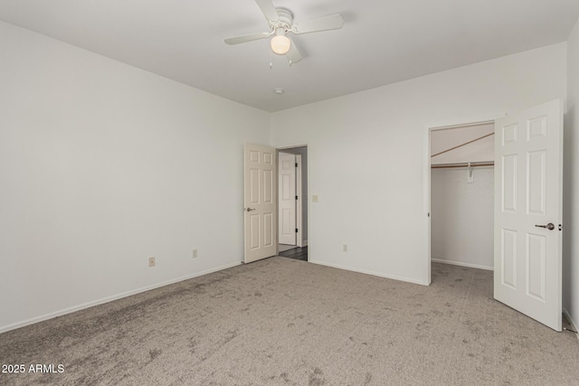 14604 W Banff Ln, Surprise, AZ 85379 - unfurnished bedroom with carpet flooring, baseboards, a ceiling fan, and a spacious closet