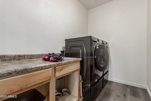 14604 W Banff Ln, Surprise, AZ 85379 - laundry area featuring separate washer and dryer, dark wood-type flooring, and baseboards