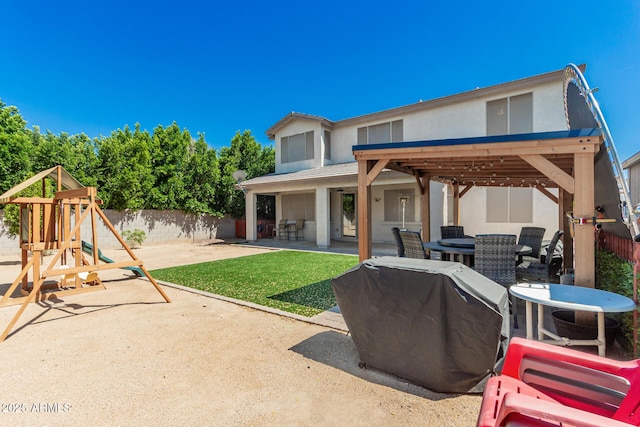 14604 W Banff Ln, Surprise, AZ 85379 - view of patio / terrace featuring outdoor dining area, a playground, and area for grilling