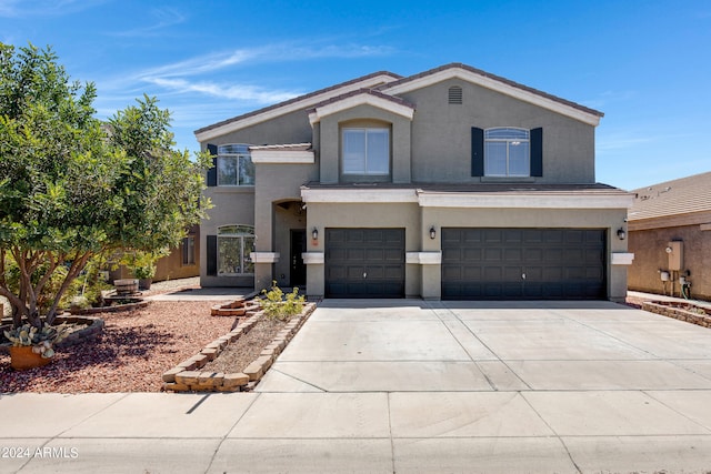 view of front of property featuring a garage