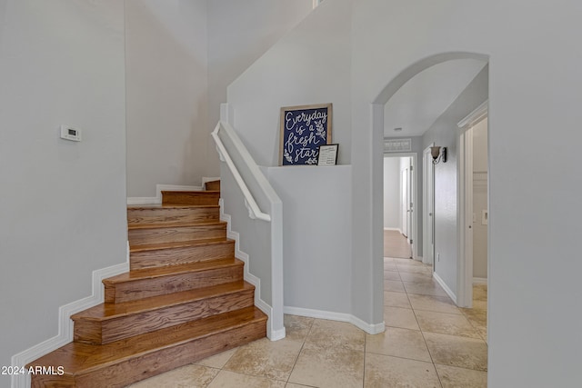 staircase with tile patterned floors