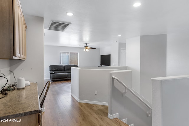 kitchen featuring wood-type flooring and ceiling fan