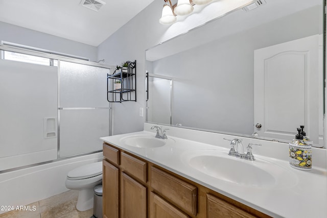 full bathroom featuring vanity, toilet, tile patterned floors, and enclosed tub / shower combo