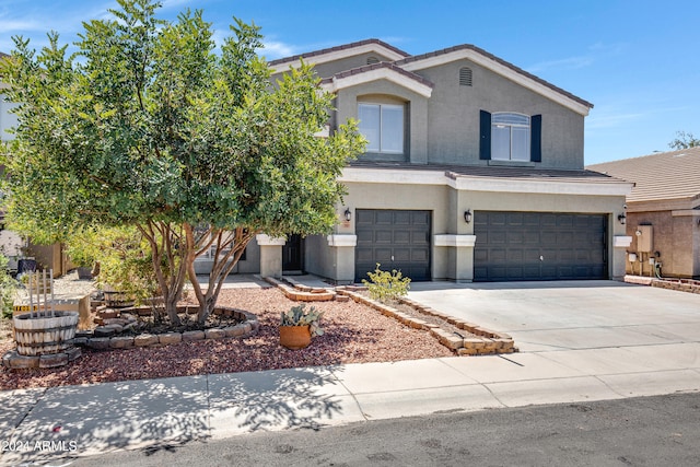 front of property featuring a garage