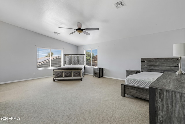 carpeted bedroom featuring lofted ceiling and ceiling fan