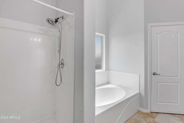 bathroom featuring separate shower and tub