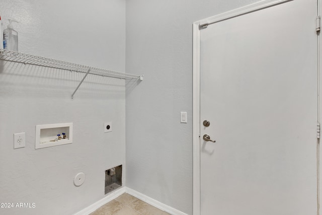 laundry area with washer hookup, hookup for an electric dryer, gas dryer hookup, and light tile patterned flooring