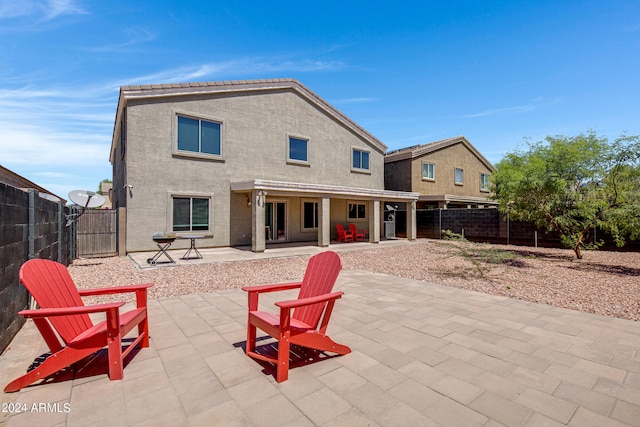 back of property with a patio area