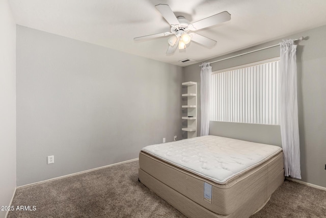 bedroom with carpet flooring, baseboards, visible vents, and ceiling fan