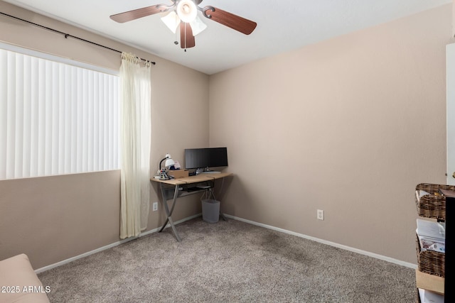 home office with ceiling fan, baseboards, and carpet