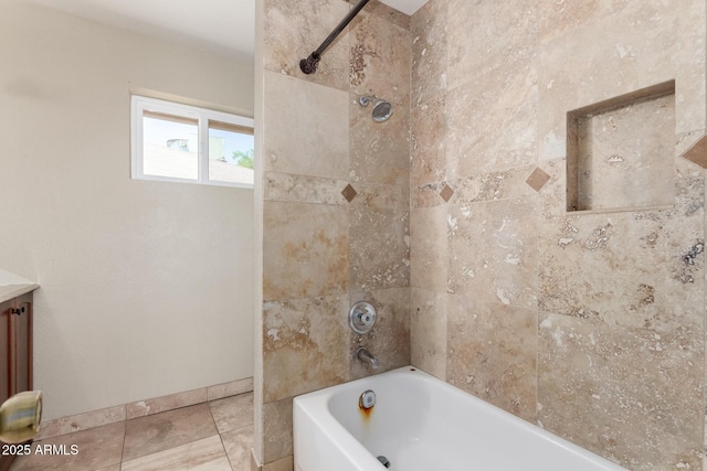 bathroom with tile patterned floors, vanity, shower / bathtub combination, and baseboards