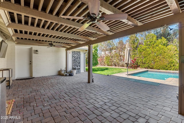 view of patio with an outdoor pool and ceiling fan