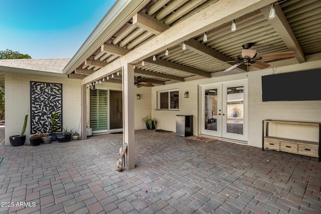 view of patio / terrace featuring a ceiling fan and french doors