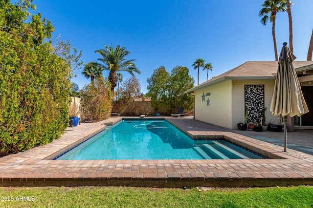 view of swimming pool featuring a patio area, a fenced in pool, and a fenced backyard