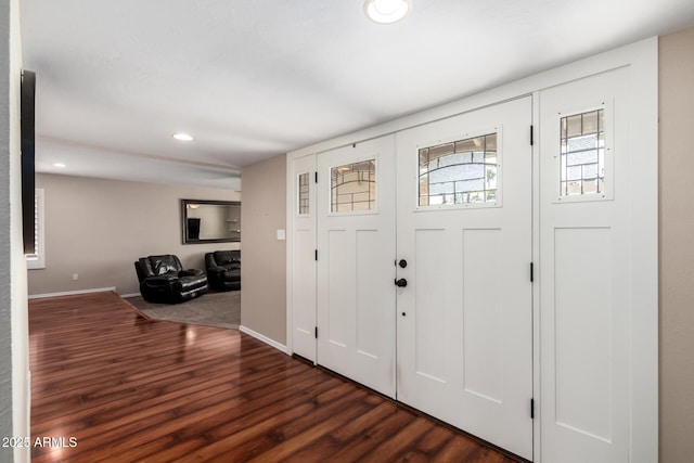 entrance foyer with recessed lighting, baseboards, and dark wood-type flooring