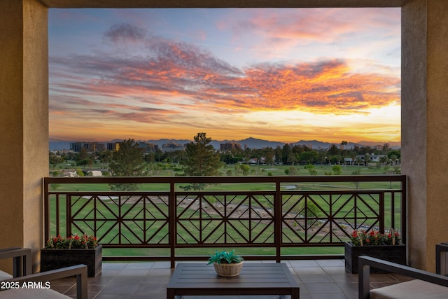 view of balcony at dusk