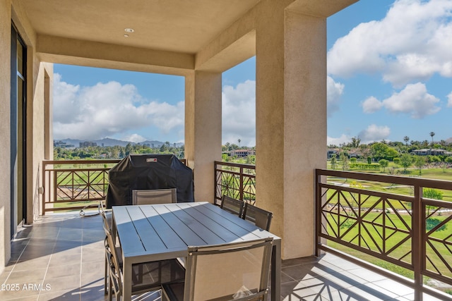 balcony with a mountain view and grilling area