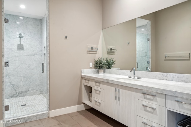 full bathroom with baseboards, a marble finish shower, tile patterned floors, vanity, and recessed lighting