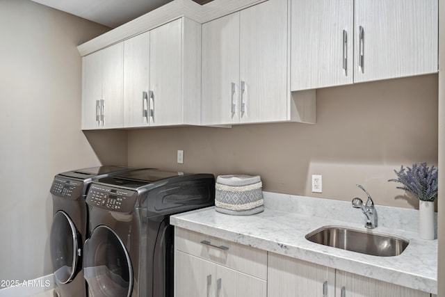 laundry room featuring cabinet space and washer and dryer