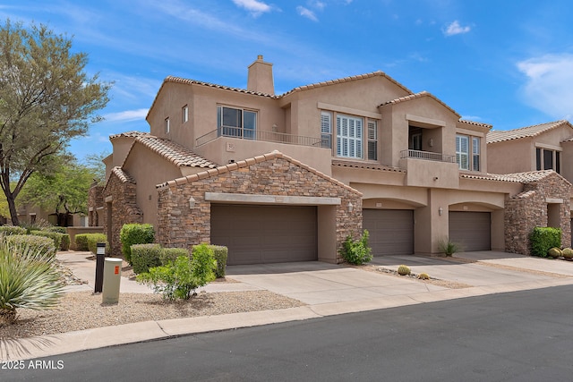 19475 N Grayhawk Dr Unit 2151, Scottsdale, AZ 85255 - view of front of home with stucco siding, a chimney, concrete driveway, stone siding, and a tiled roof