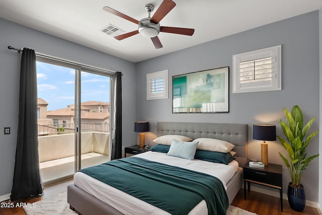 19475 N Grayhawk Dr Unit 2151, Scottsdale, AZ 85255 - bedroom featuring access to exterior, wood finished floors, baseboards, and ceiling fan