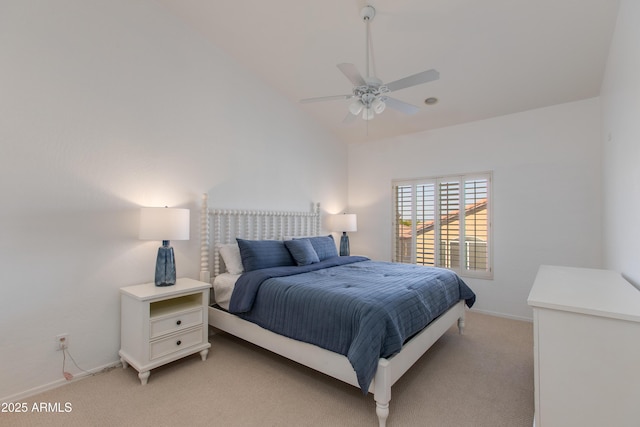 bedroom with light carpet, baseboards, a ceiling fan, and lofted ceiling