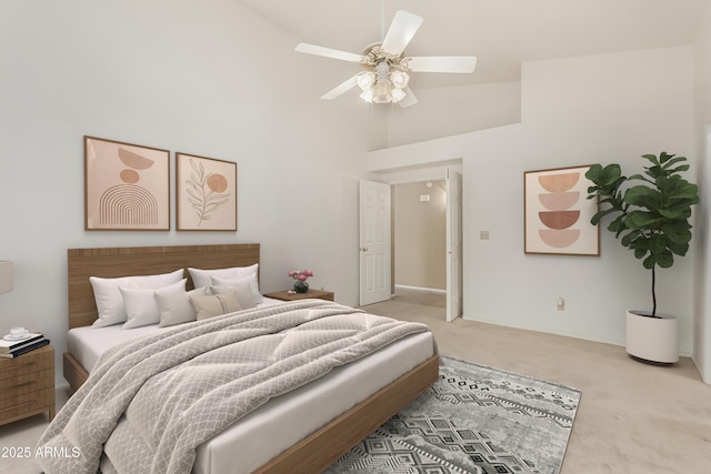 bedroom featuring carpet floors, ceiling fan, and high vaulted ceiling