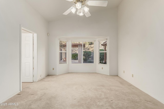 unfurnished room with carpet floors and ceiling fan