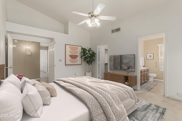 bedroom featuring high vaulted ceiling, light colored carpet, visible vents, and connected bathroom