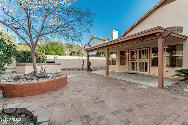 view of patio with fence