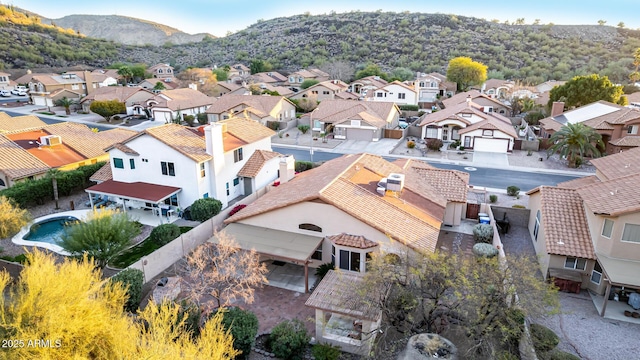 drone / aerial view with a residential view and a mountain view