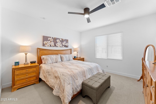 bedroom featuring light carpet, ceiling fan, visible vents, and baseboards