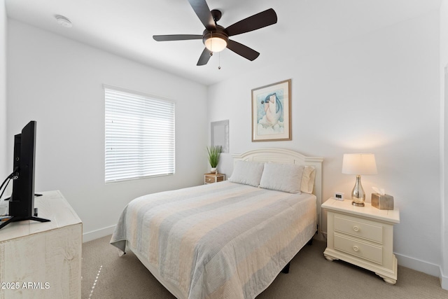 bedroom featuring ceiling fan, carpet flooring, and baseboards