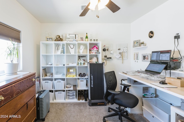 office area with ceiling fan and light carpet