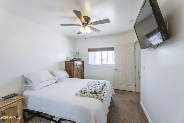 bedroom featuring ceiling fan and dark colored carpet