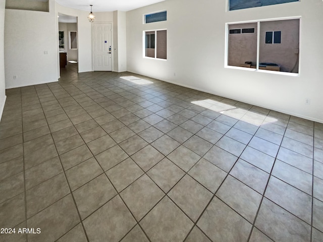 unfurnished room with tile patterned floors