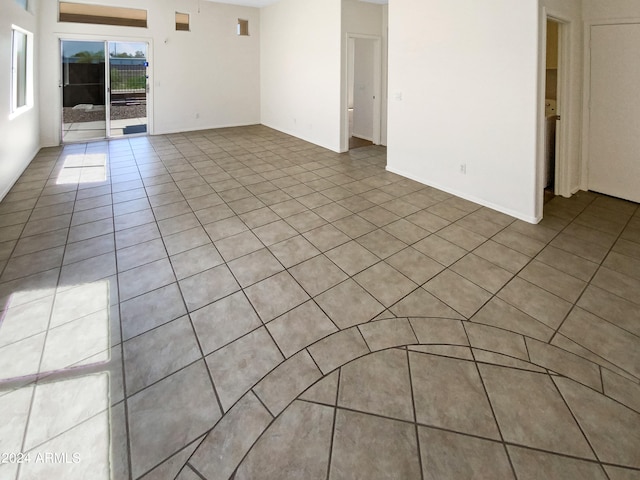 spare room featuring light tile patterned floors