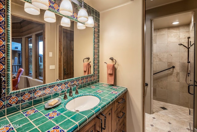 bathroom featuring vanity and an enclosed shower