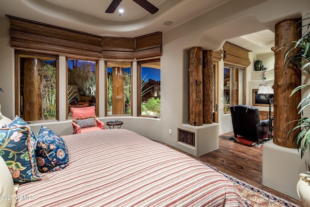 bedroom featuring wood-type flooring and ceiling fan