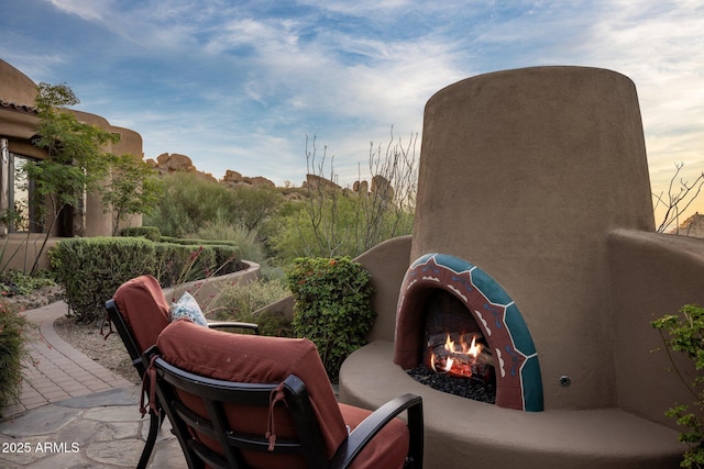 view of patio featuring an outdoor fireplace