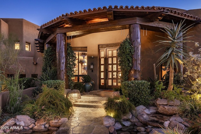 property entrance featuring french doors