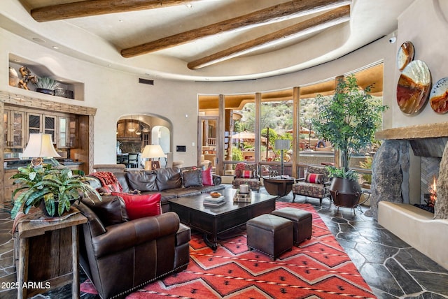 living room with beam ceiling