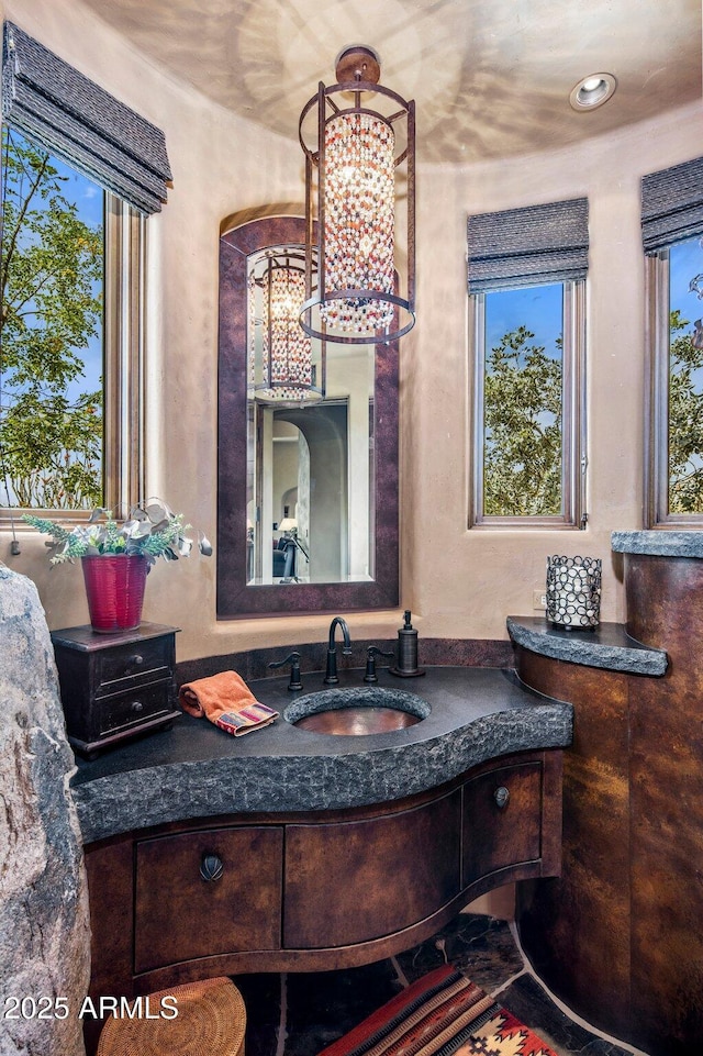 bathroom with vanity and plenty of natural light