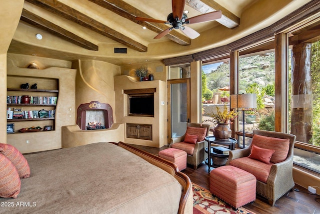 bedroom featuring wood-type flooring and beamed ceiling