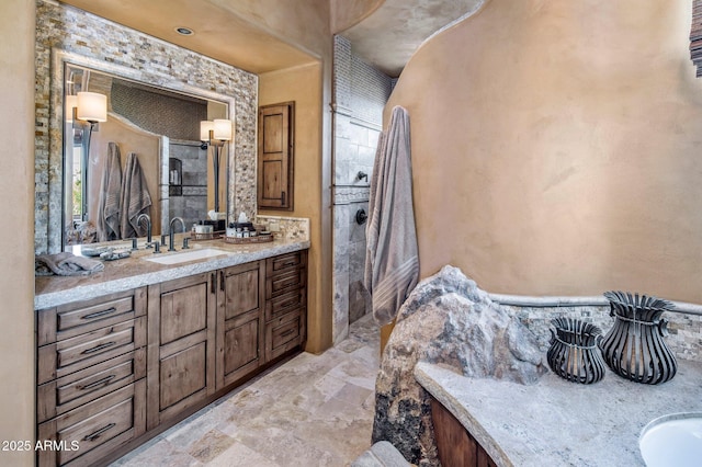 bathroom featuring vanity and walk in shower