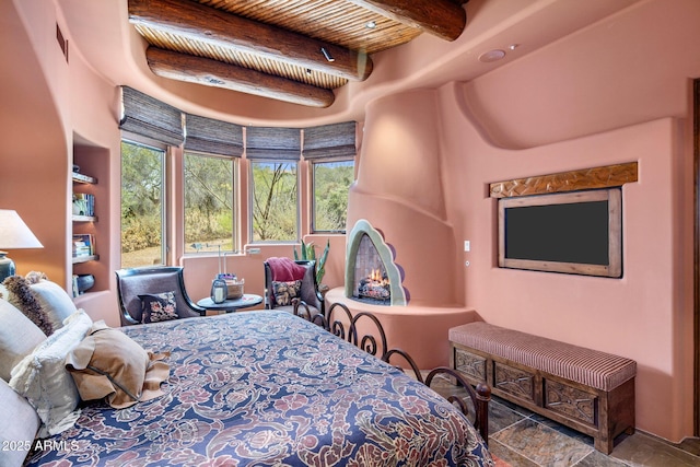 bedroom featuring beam ceiling and wooden ceiling